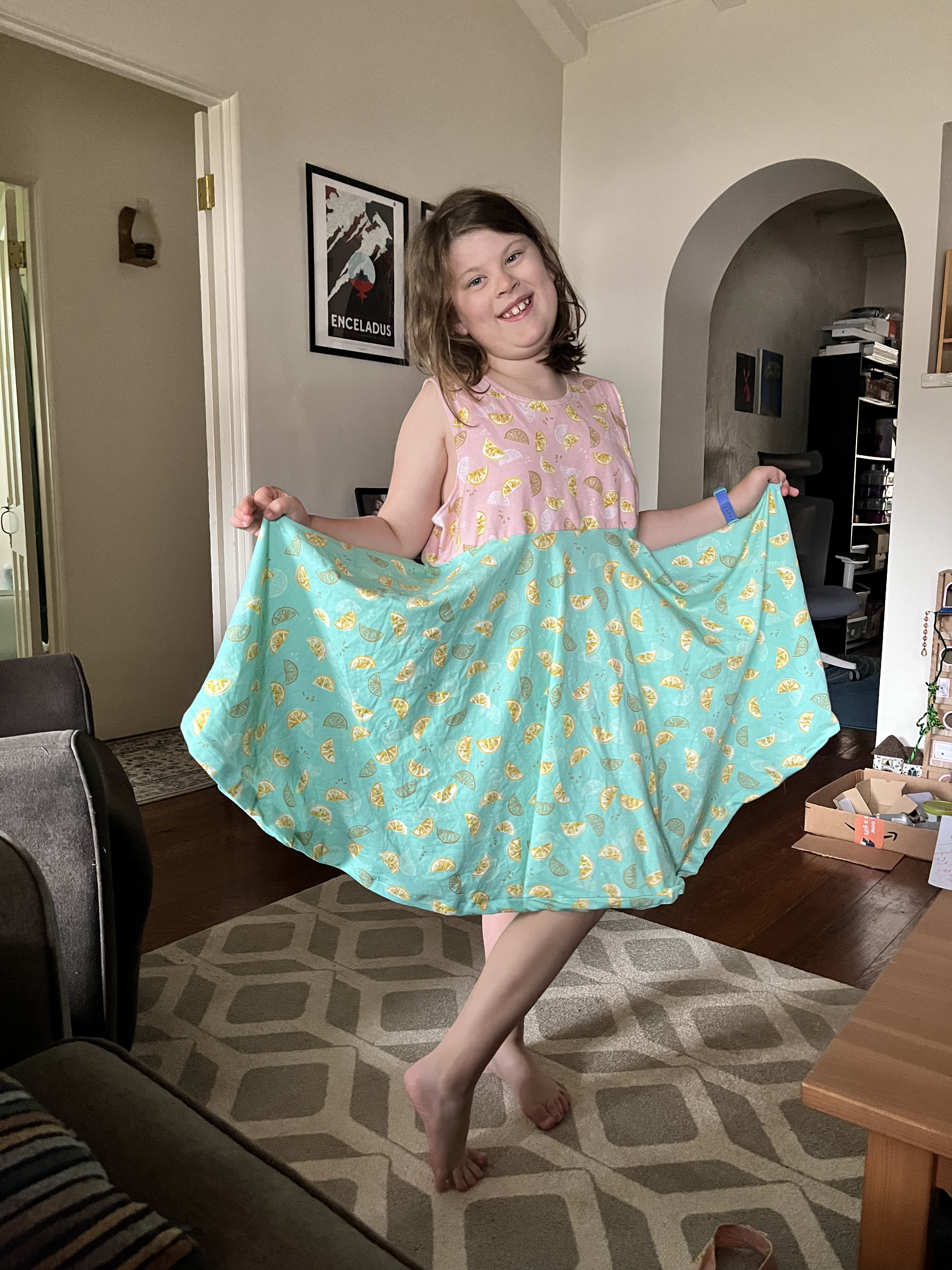 Child wearing finished pink and teal lemon skirt