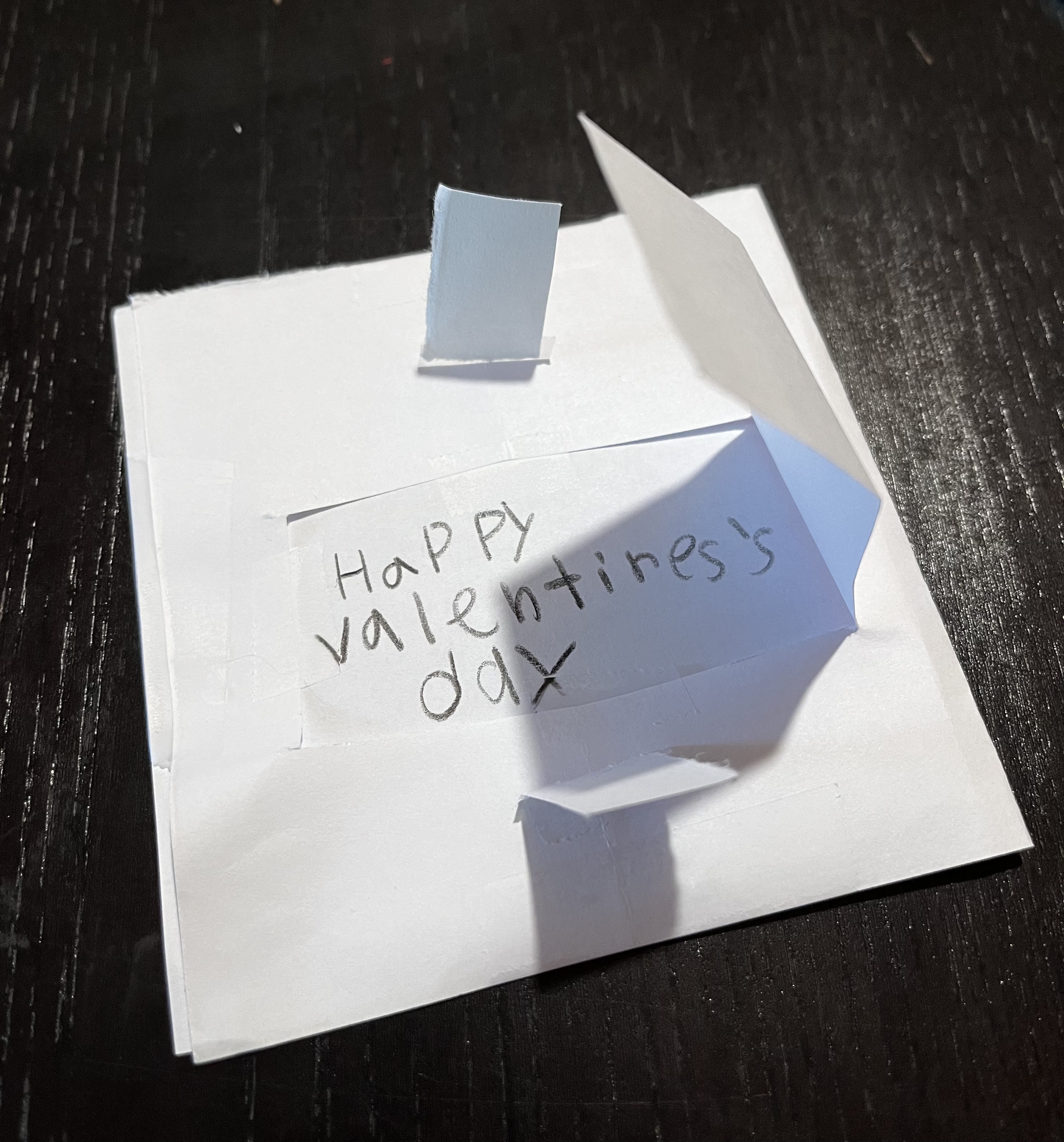 A paper prototype of a valentine with a little flap exposing a “Happy Valentine’s Day” message below.